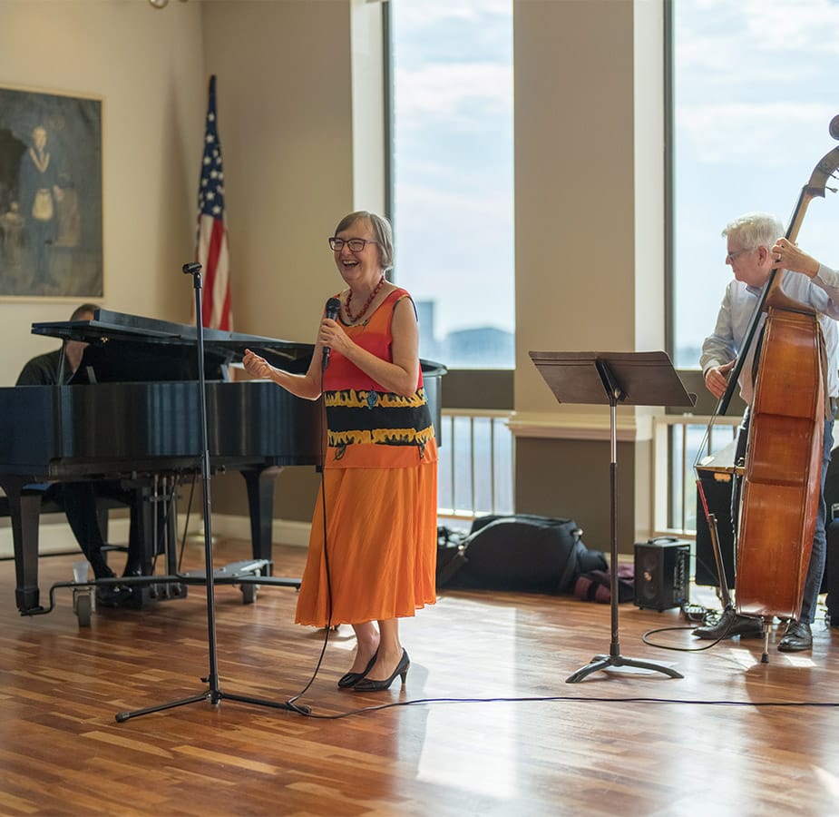 trio of seniors singing and playing instruments Residents playing instruments and singing.