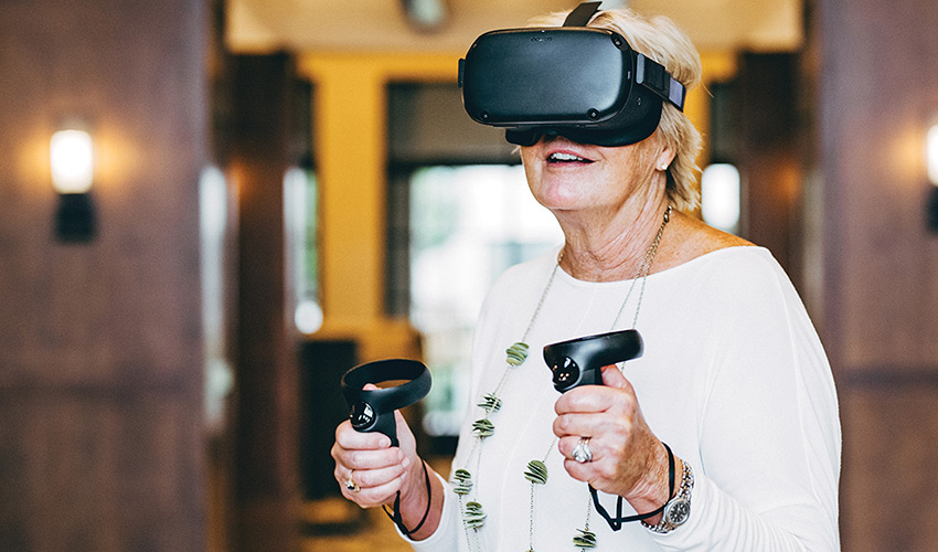A woman playing with a virtual reality set.