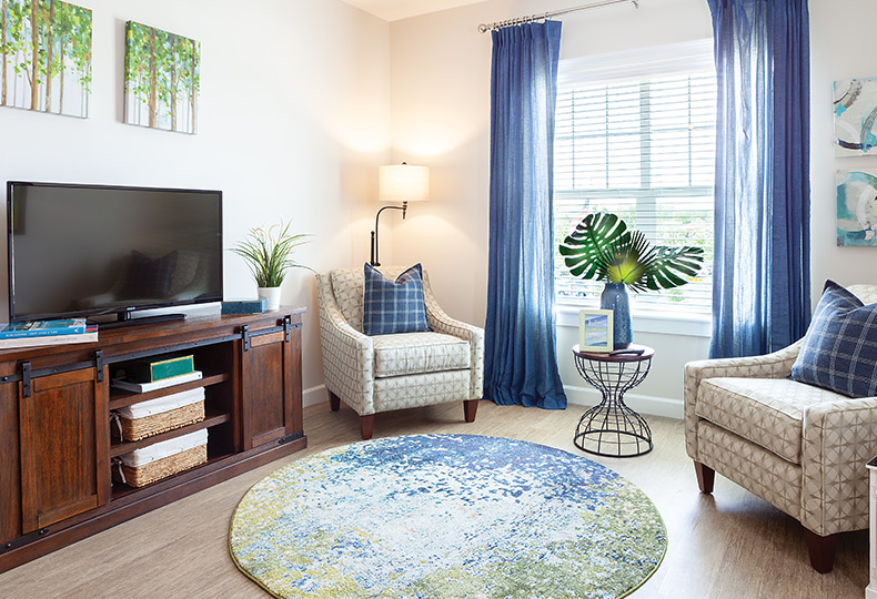 Seating area in living room with tv.