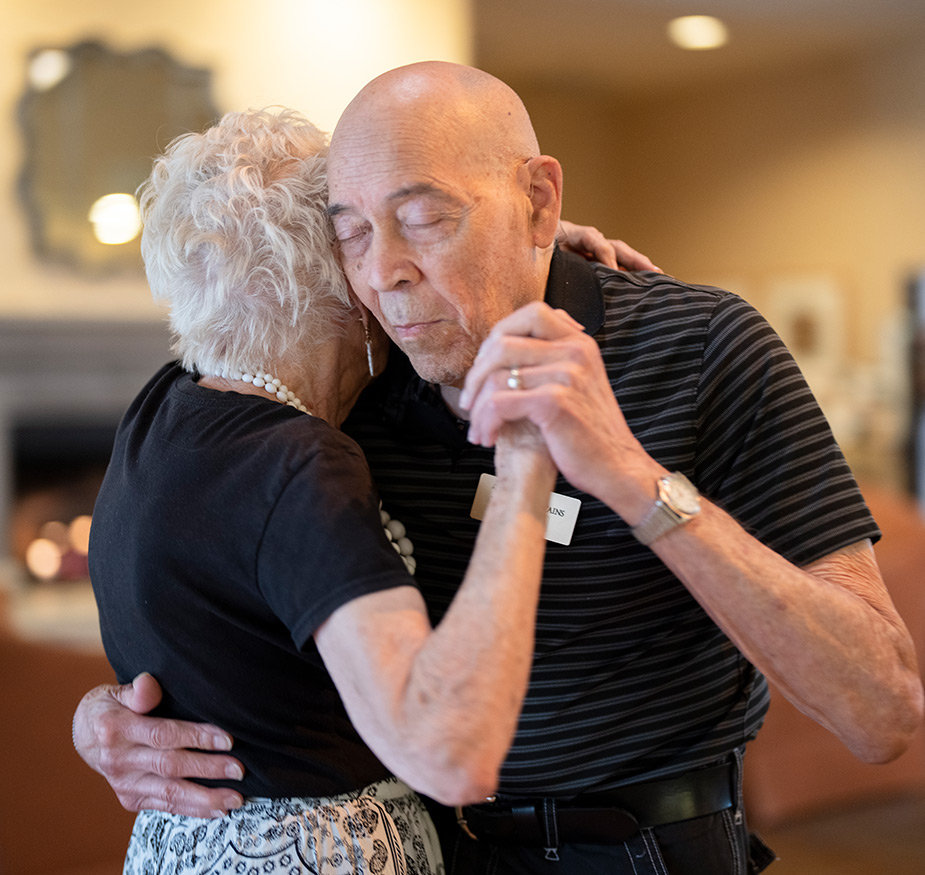 Two residents are dancing.