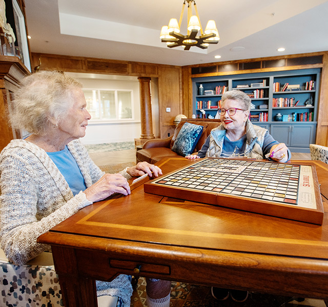 Two residents playing Scrabble.