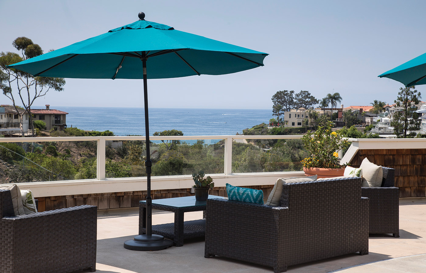 An outdoor seating area with an ocean view at Crown Cove.