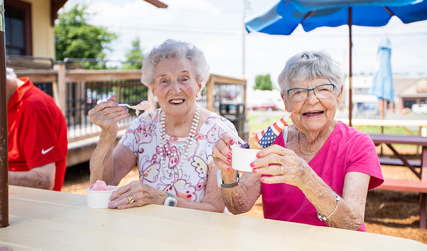 People enjoying ice cream outside.