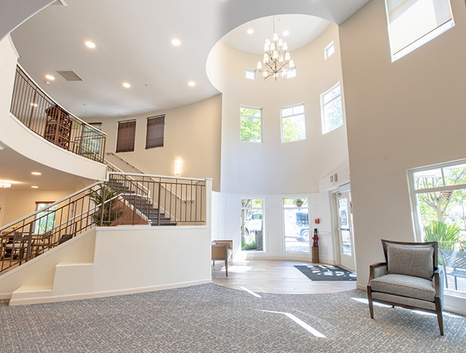 Fremont Hills white lobby with windows.