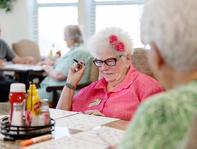 A resident playing Bingo.