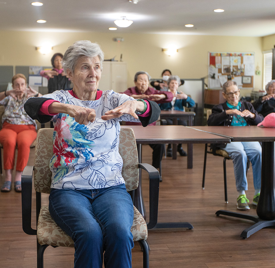 A group seated tai chi class.
