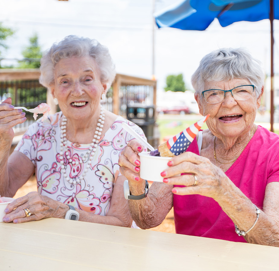 Two residents are laughing.