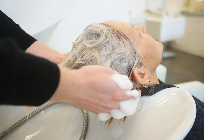 A resident getting hair washed.