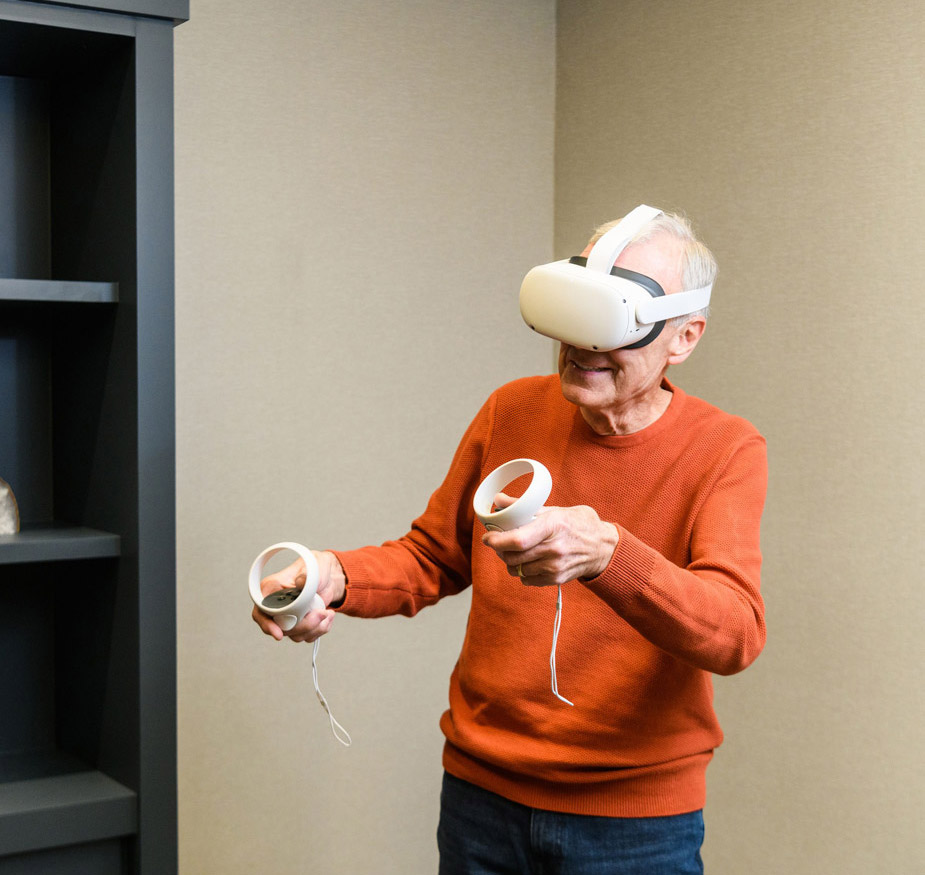 A resident is using the Engage VR set.