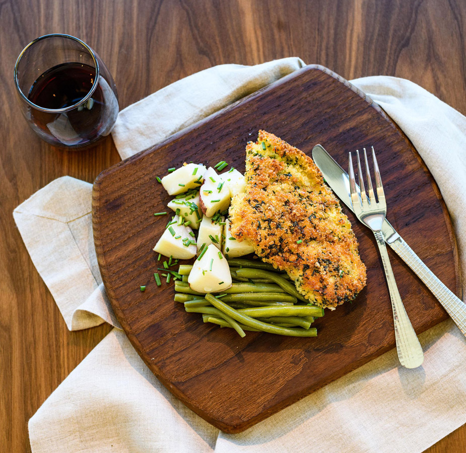 A plate of food consisting of salmon and vegetables.