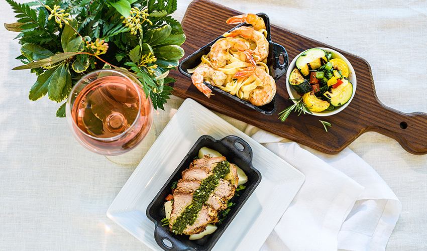 A variety of food including shrimp, pork and vegetables.