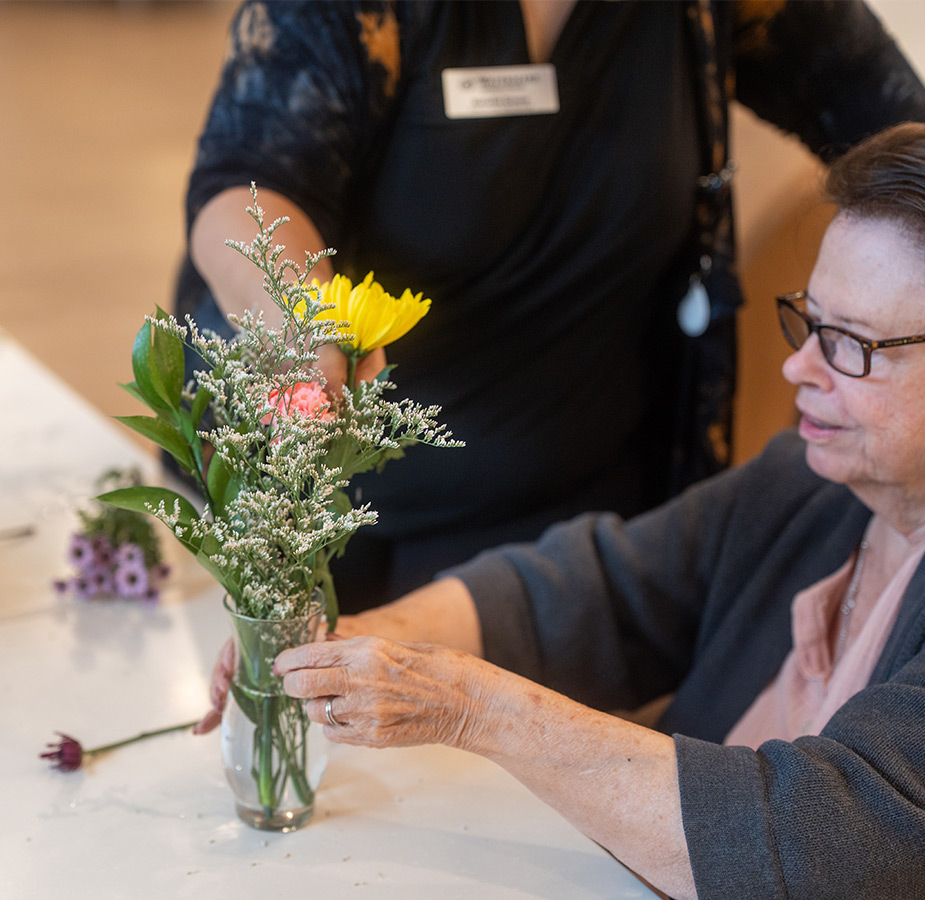 A person arranging flowers.
