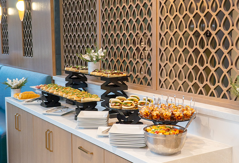 A bunch of bite sized desserts on a table.