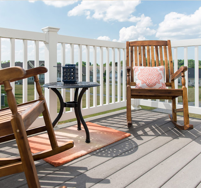 Rocking chairs on a porch.