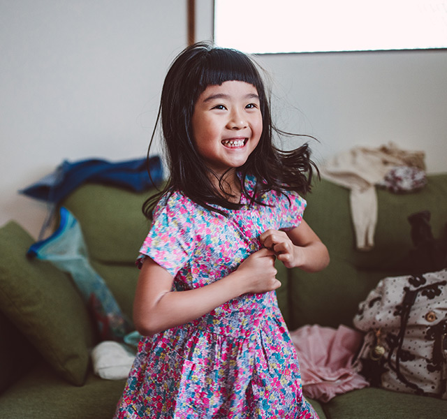 A child is smiling.
