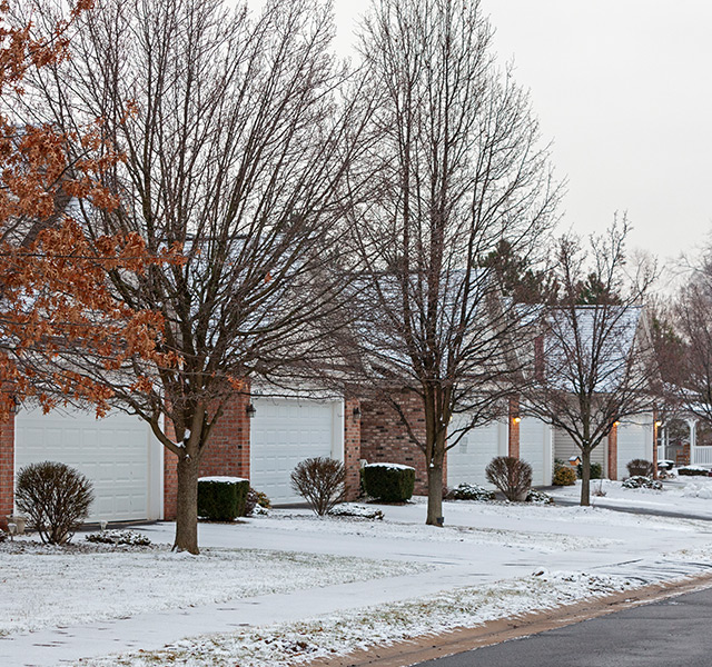 The exteriors of villas during winter at The Legacy at Park Crescent.