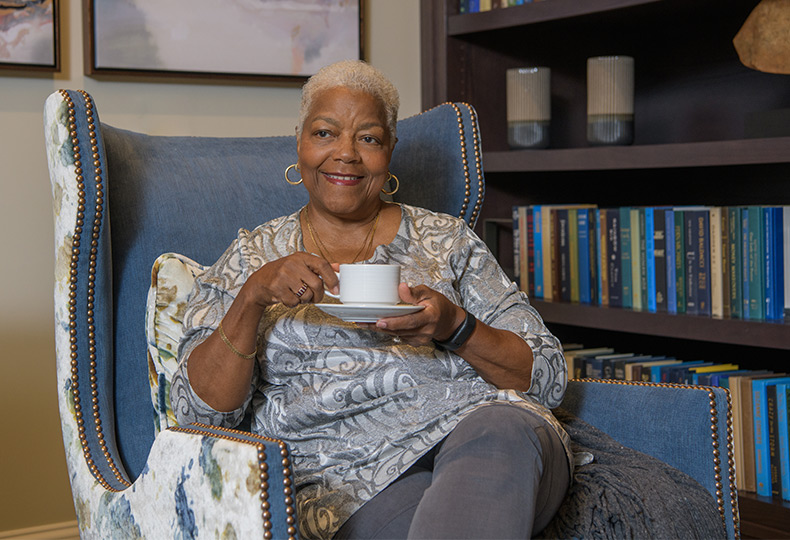A resident happily sitting.