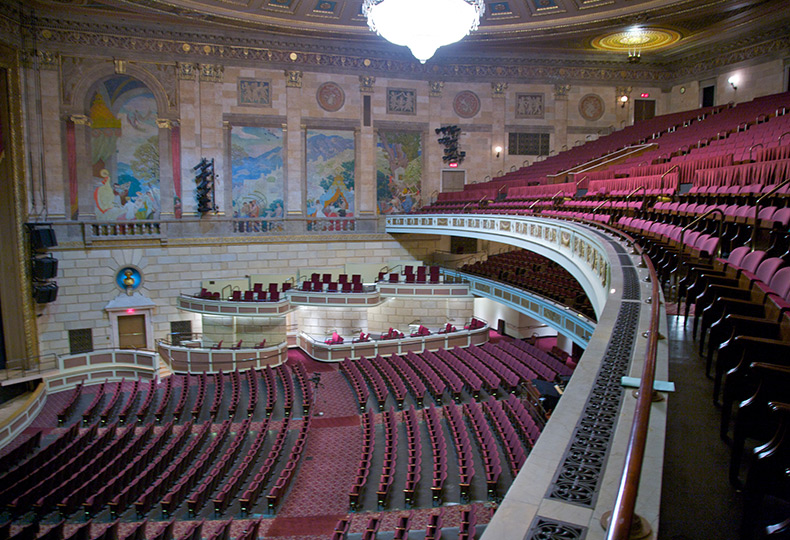 Side view of the inside of Kodak Hall Theater showing seats and the stage.