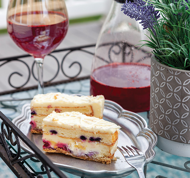 Pastries with juice on a table.