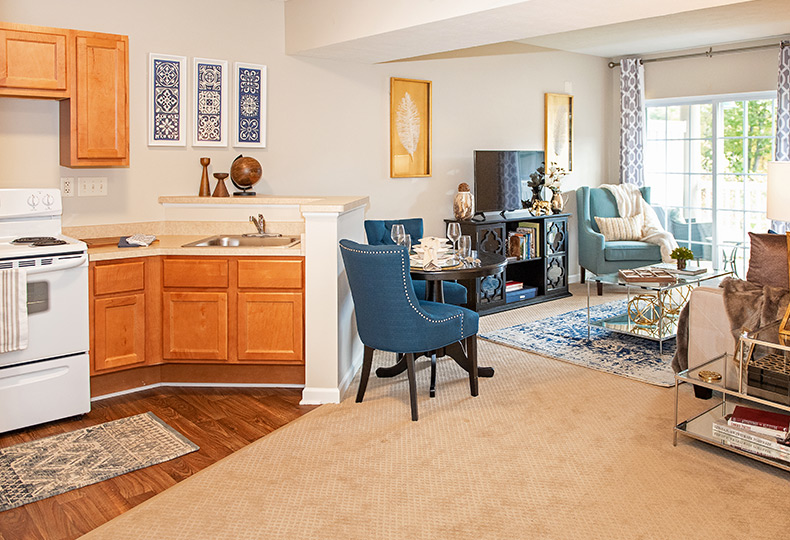 A combined kitchen living room area.