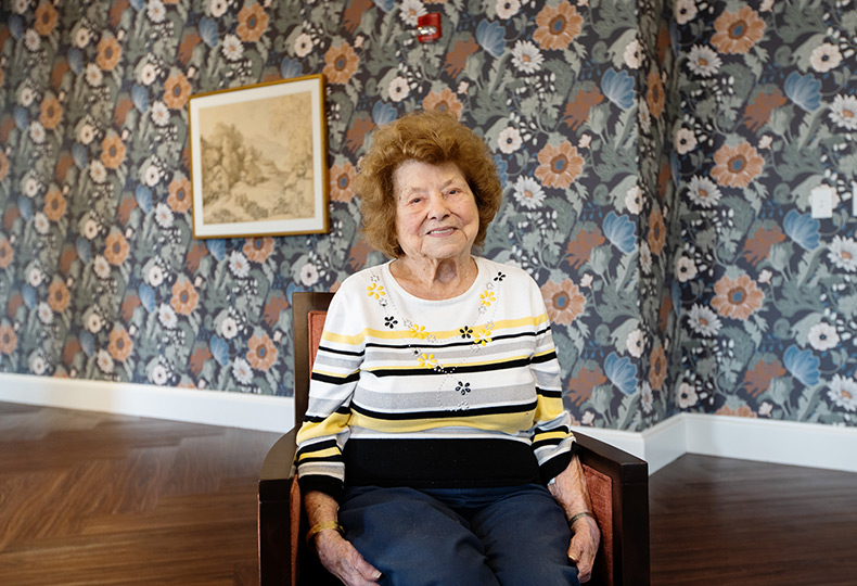 A woman sitting in a chair.