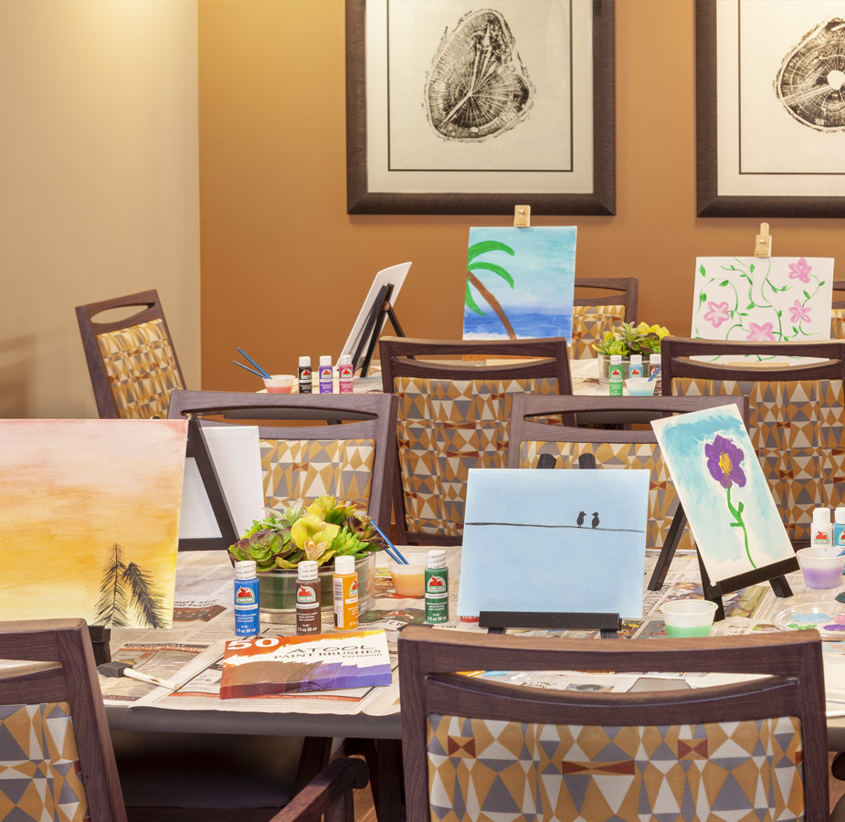 Tables with canvases from art activity.