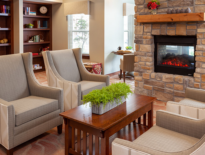 The Lodge at North Ogden seating area by fireplace.