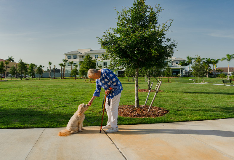 A person with their dog outside.