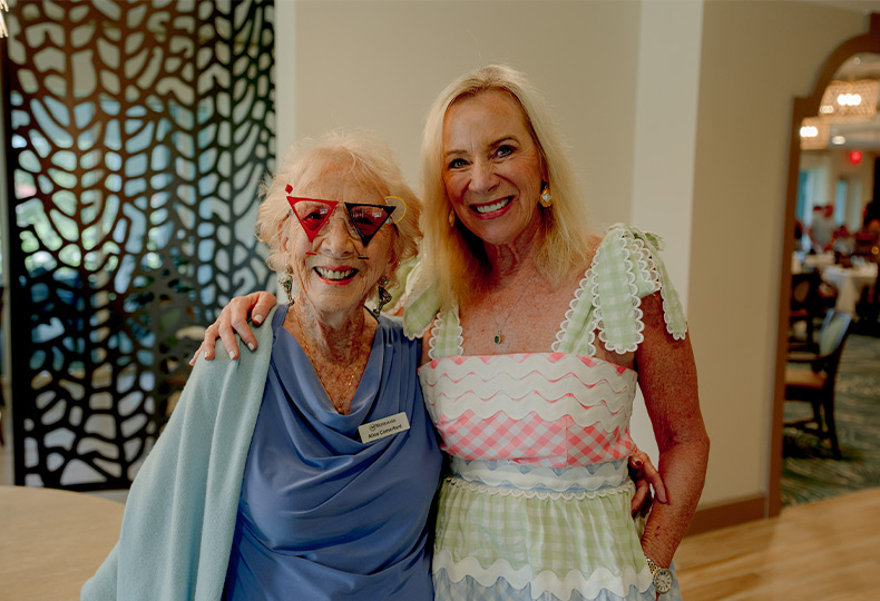 Two people smiling.