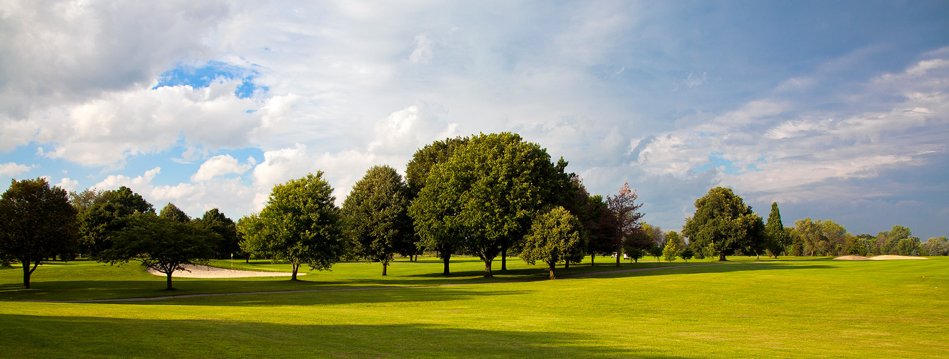 Golf course with trees.