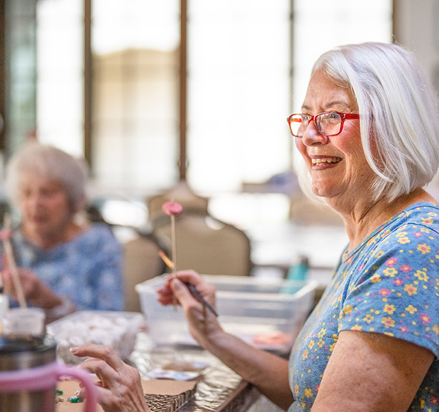 Residents enjoy a painting class.