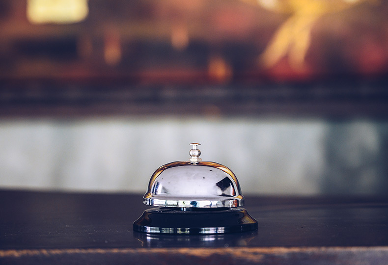 Bell on top of a desk.