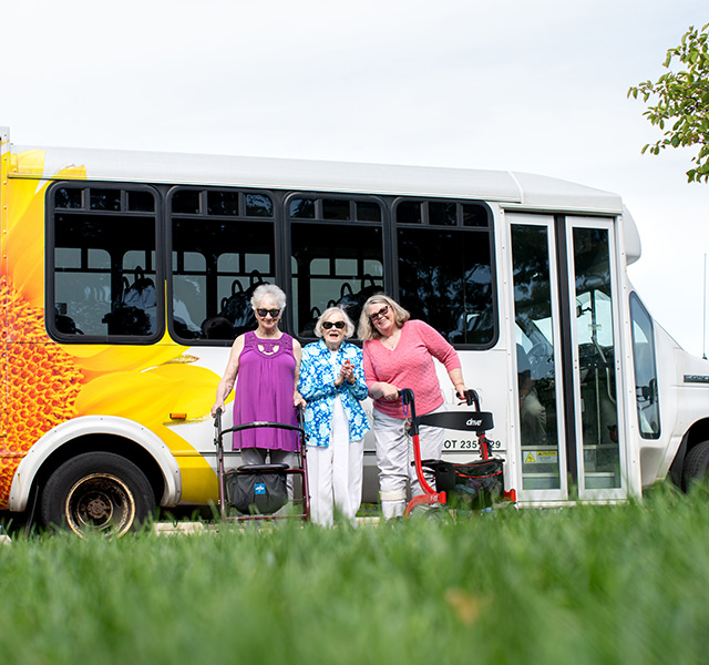 Residents in front of a shuttle.