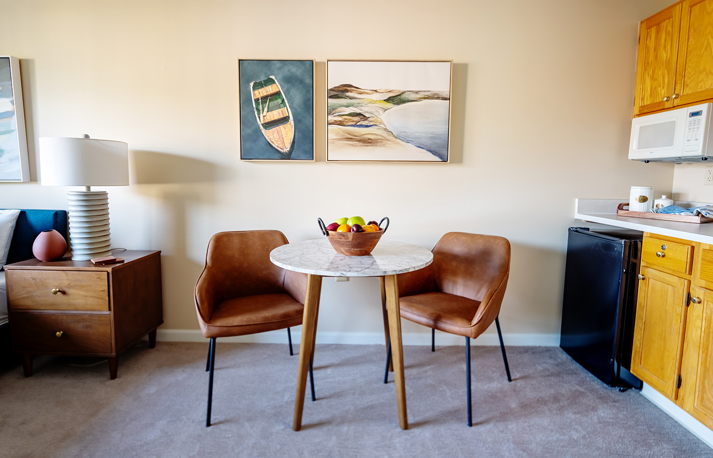 A furnished dining area in a studio apartment.