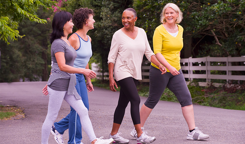 four friends walking together outside