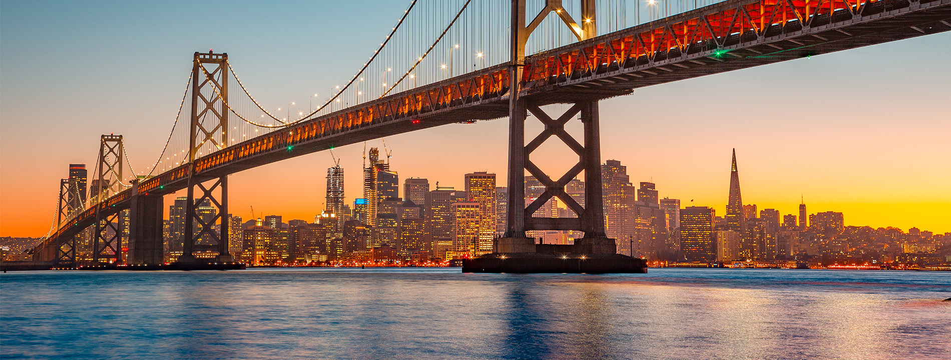 The golden gate bridge at sunset.