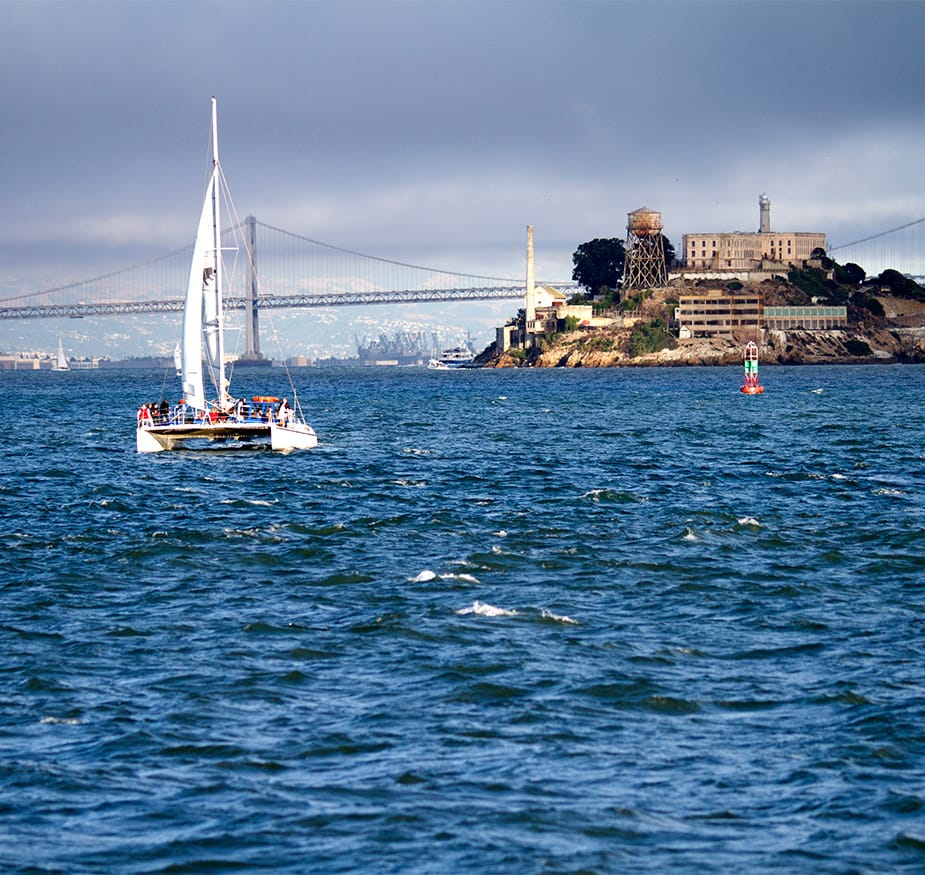 A boat is sailing by Alcatraz.