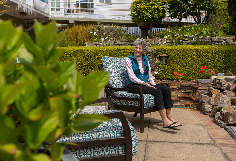A resident is sitting outside.