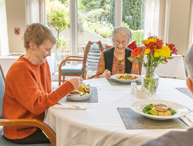 Residents are having a meal together.
