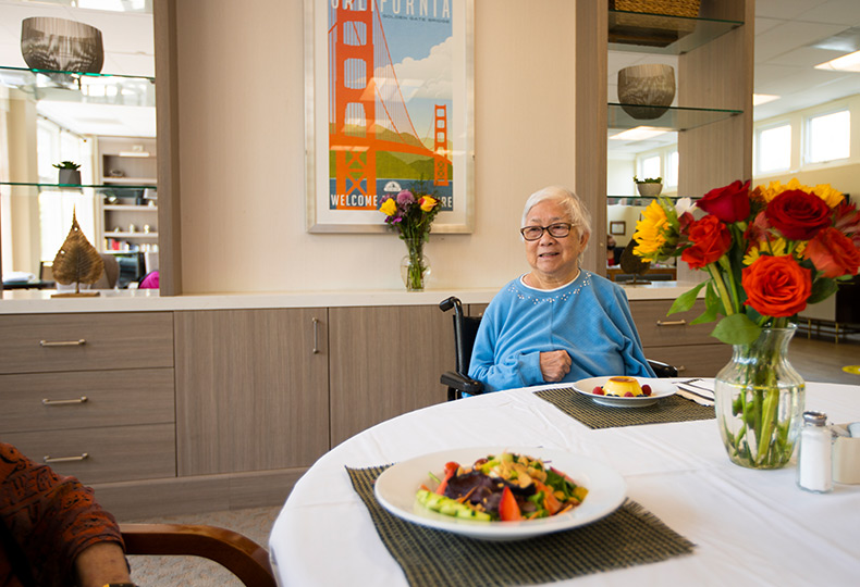 Residents are having a meal together.