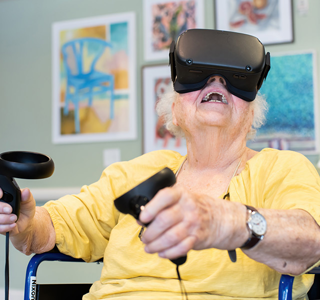 A resident with a VR headset on.