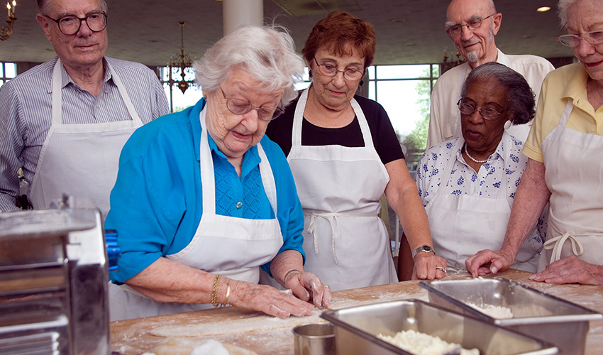 A group of seniors in a cooking class.