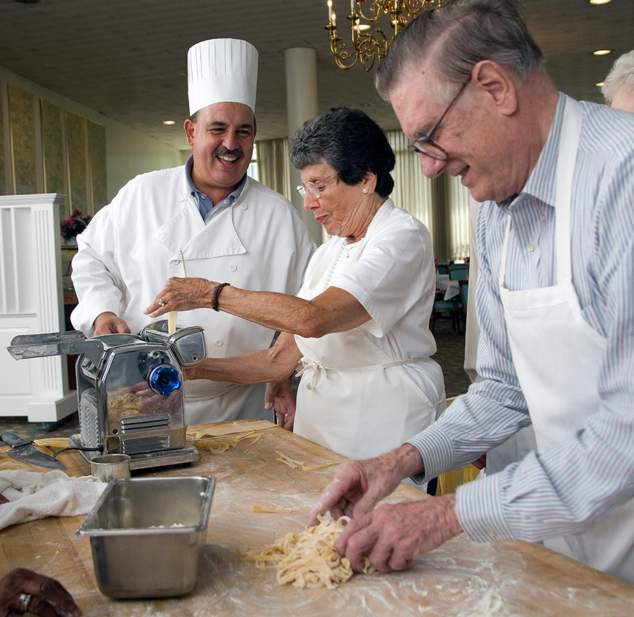 Residents are participating in a pasta class.