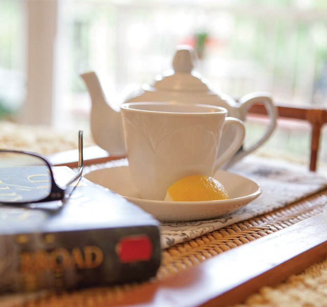A tea pot on a tray.