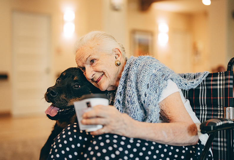 A resident sits with their dog.
