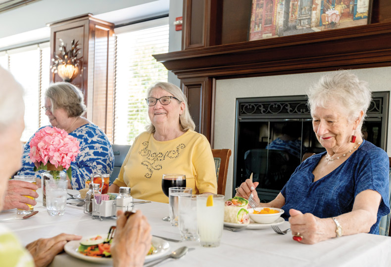 A group of residents having their meals together.