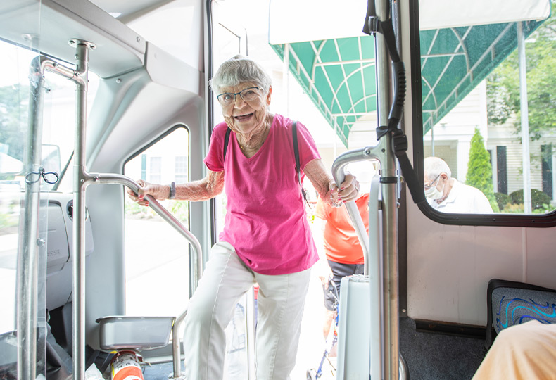 A resident is entering the bus.