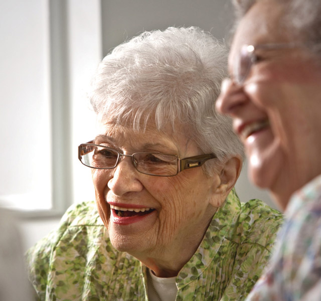 Two residents are smiling.