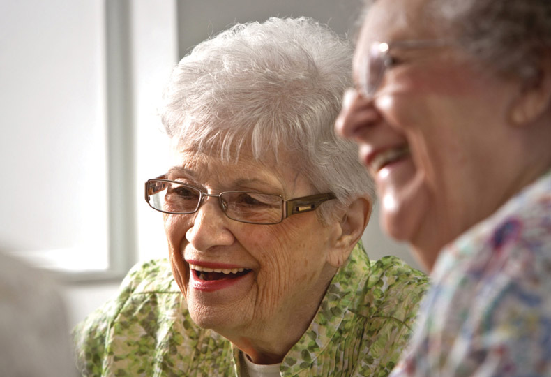 Two residents are smiling.