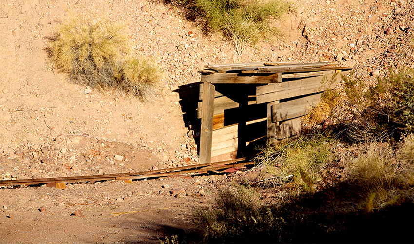 The entrance of a mine shaft.